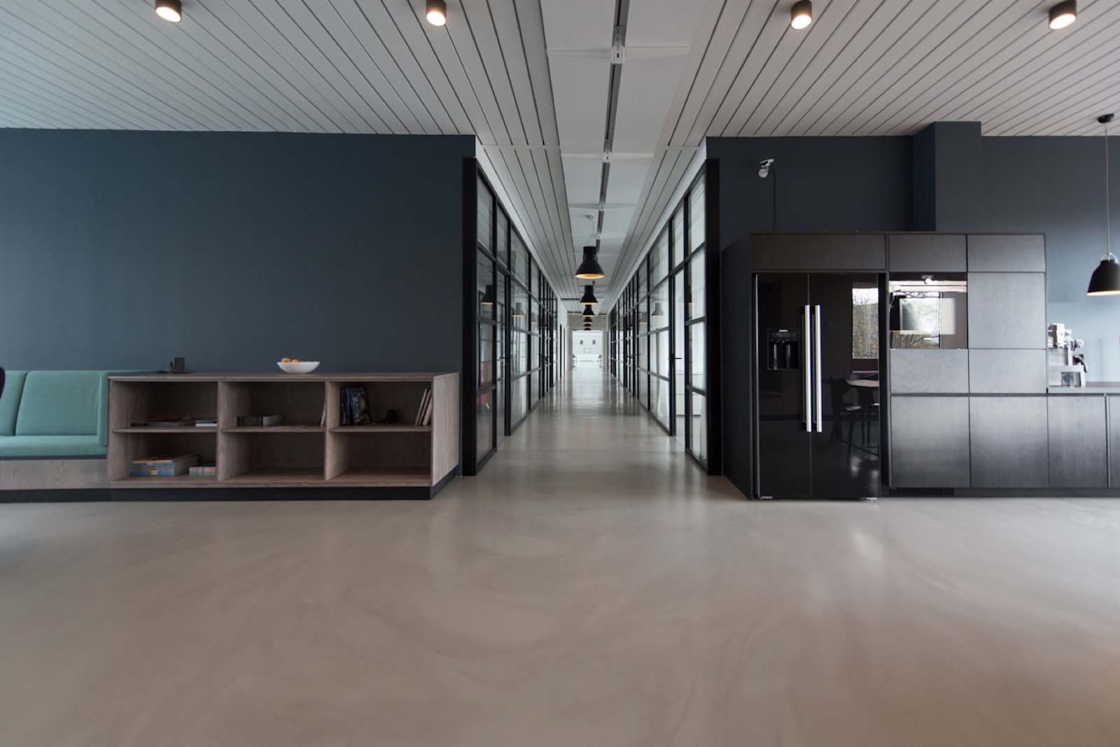 An empty modern office with glass walls.