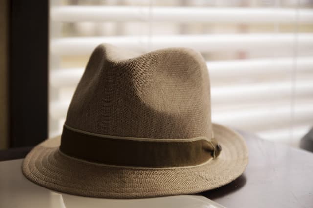 Heritage fedora on a wood surface